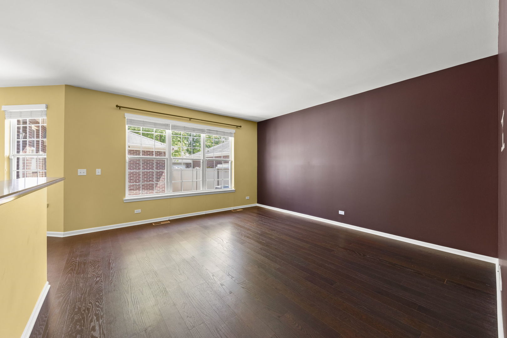 235 Garden Drive Elgin, IL 60124 - Photo 8 of 25 a view of an empty room with wooden floor and a window