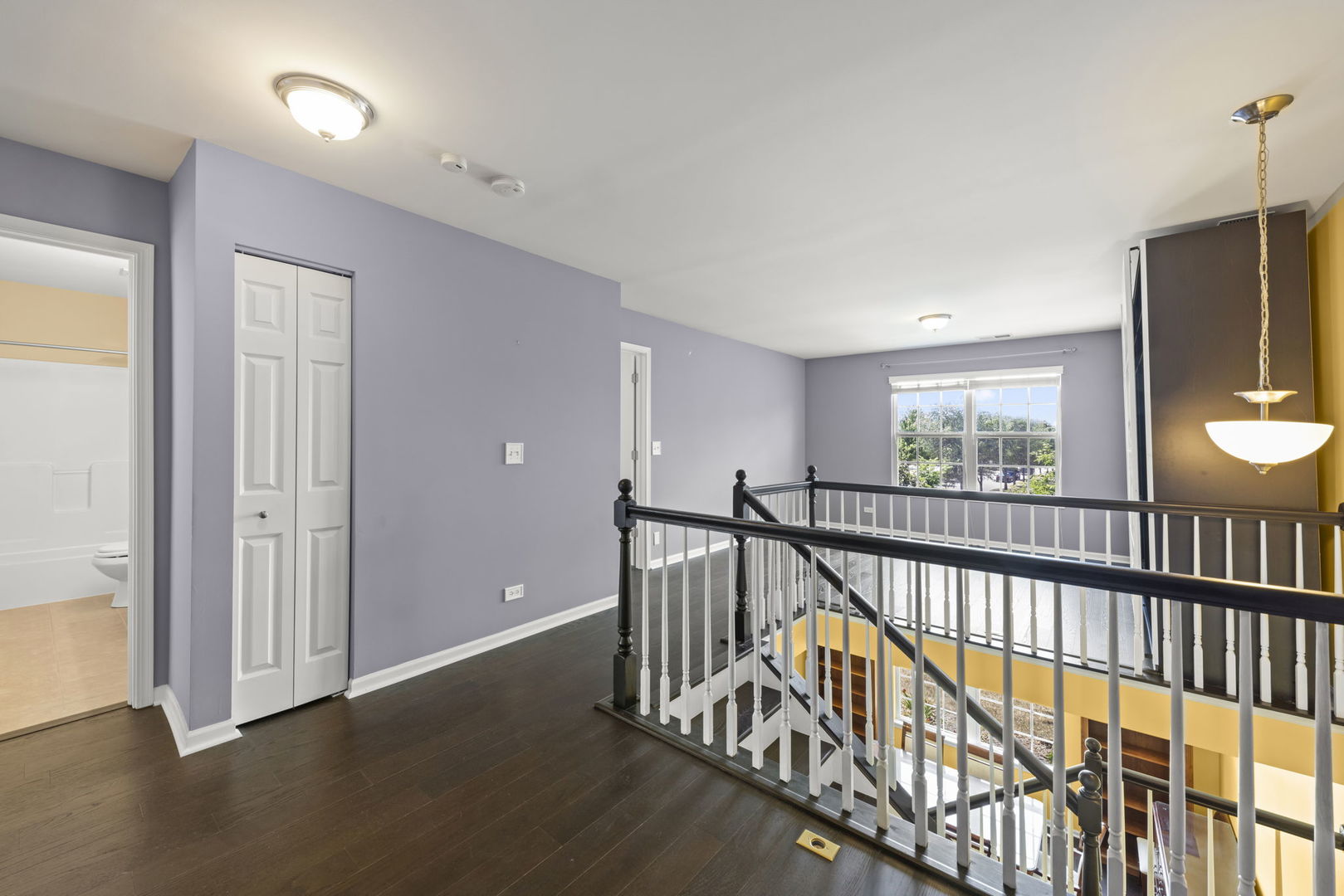 235 Garden Drive Elgin, IL 60124 - Photo 9 of 25 a view of hallway with wooden floor