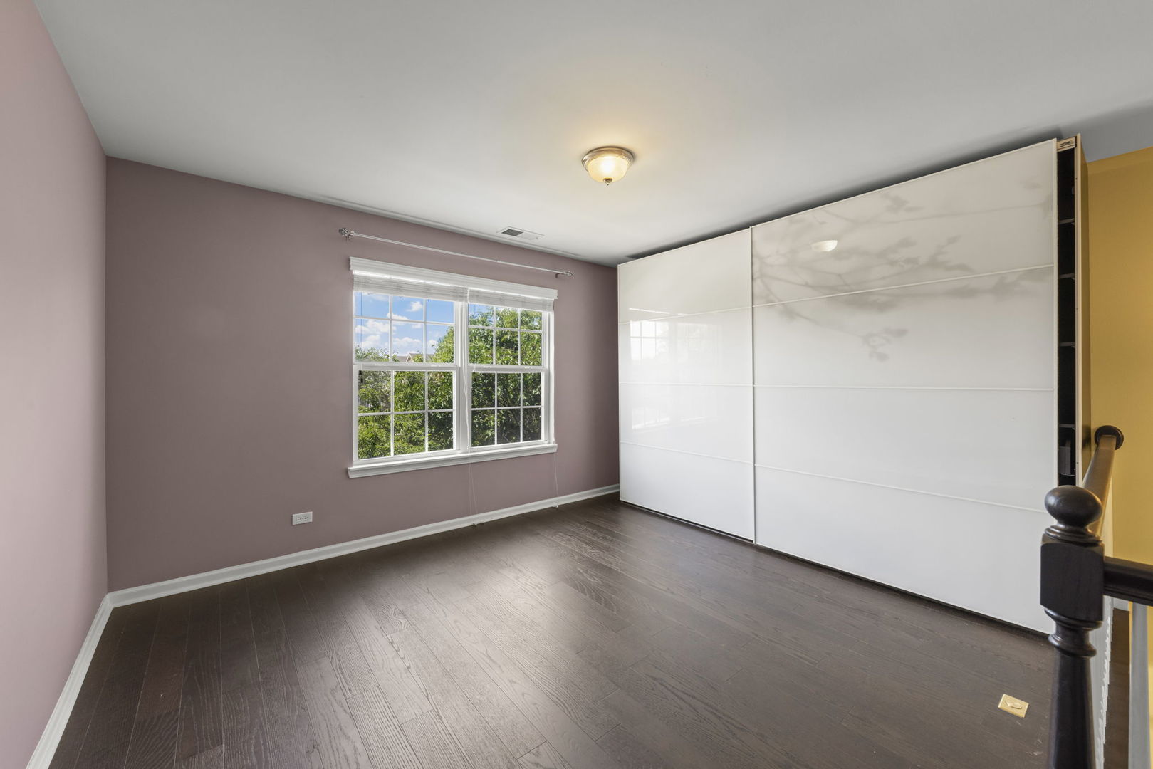 235 Garden Drive Elgin, IL 60124 - Photo 10 of 25 a view of a livingroom with wooden floor and window