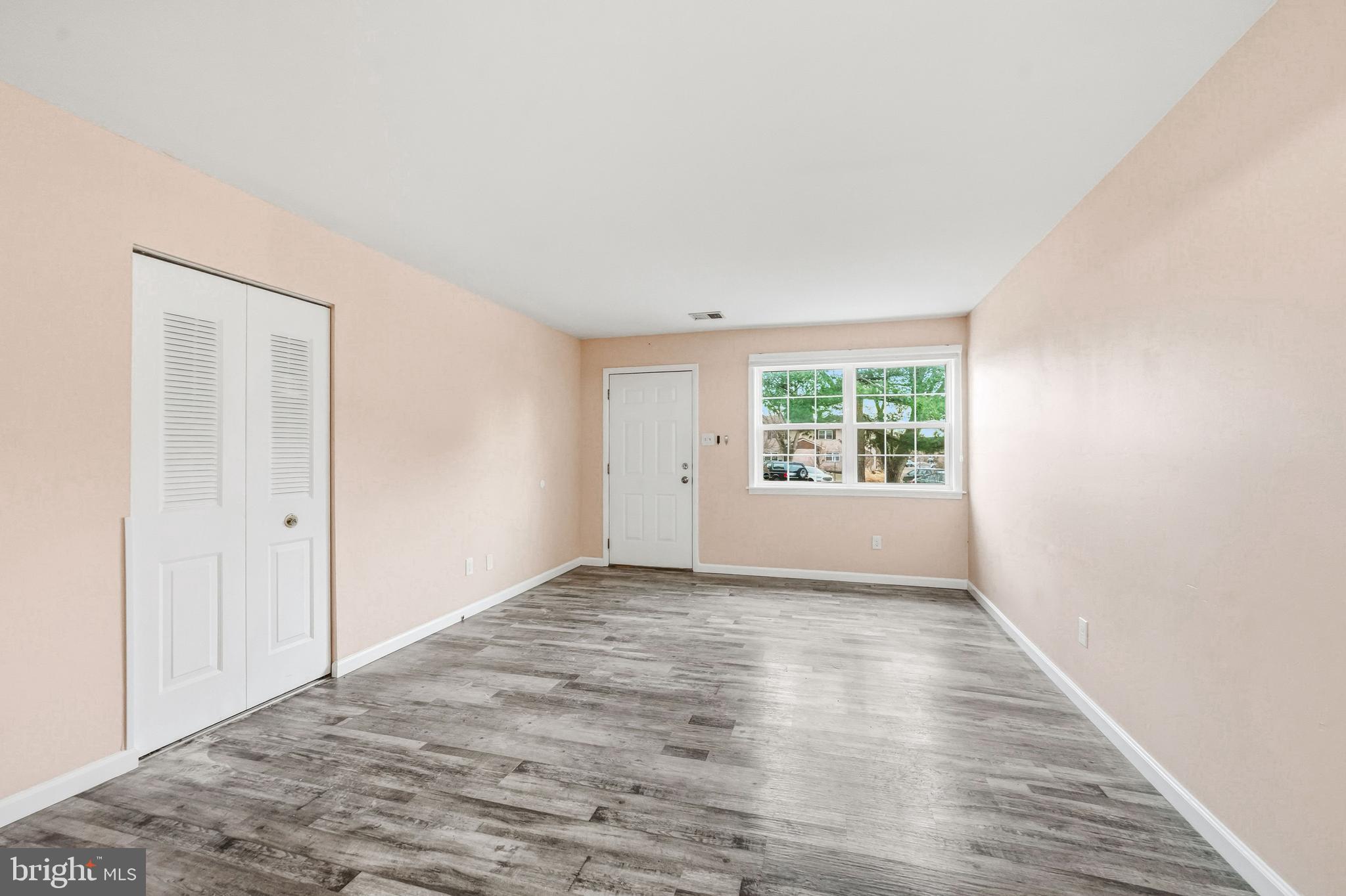 114 Eaves Mill Road Medford, NJ 08055 - Photo 4 of 20 a view of an empty room with a window