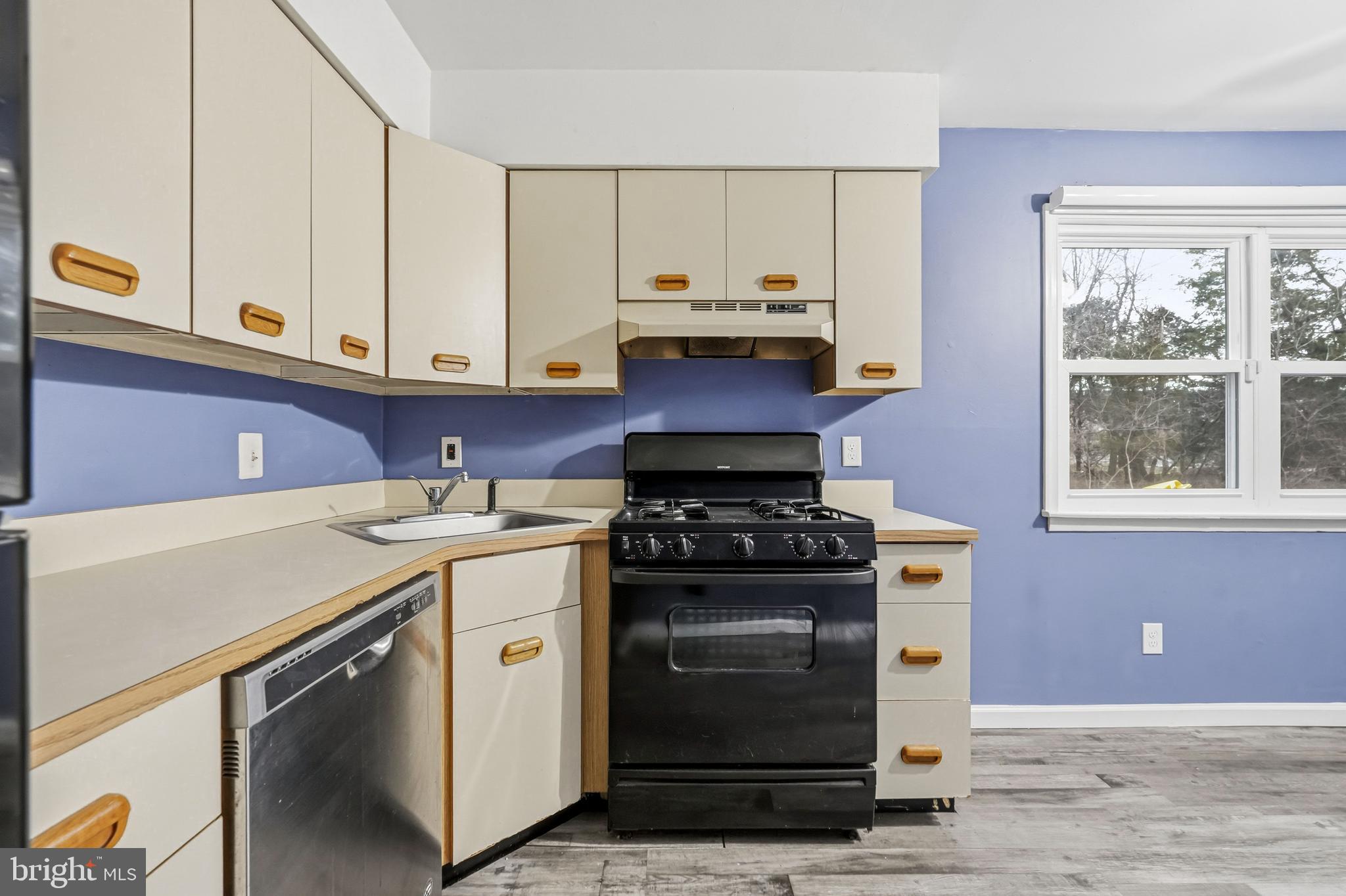114 Eaves Mill Road Medford, NJ 08055 - Photo 10 of 20 a kitchen with a stove and a sink