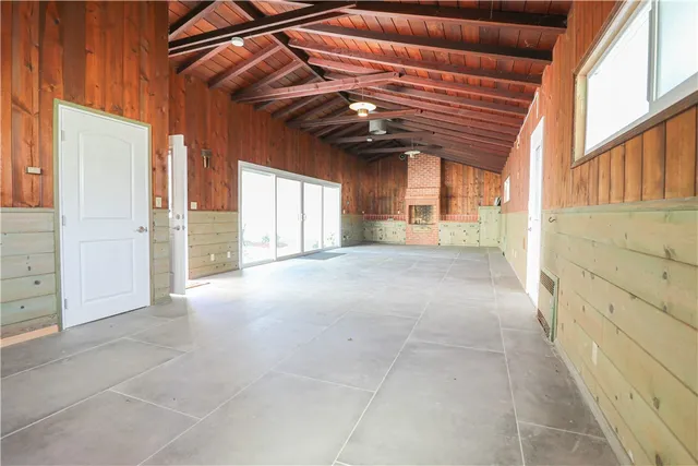 a view of a room with a window and chandelier