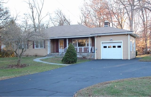 43 Red Bird Road Stamford, CT 06905 - Photo 1 of 1 a view of a house with a yard and garage