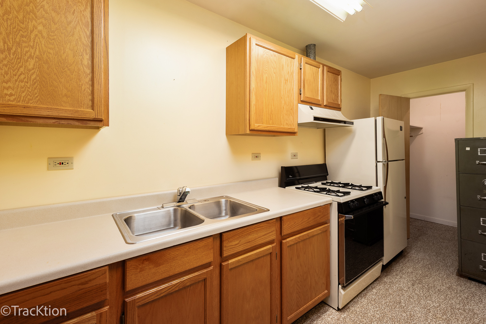 12S440 Lemont Road Lemont, IL 60439 - Photo 12 of 28 a kitchen with stainless steel appliances granite countertop a sink a stove and refrigerator