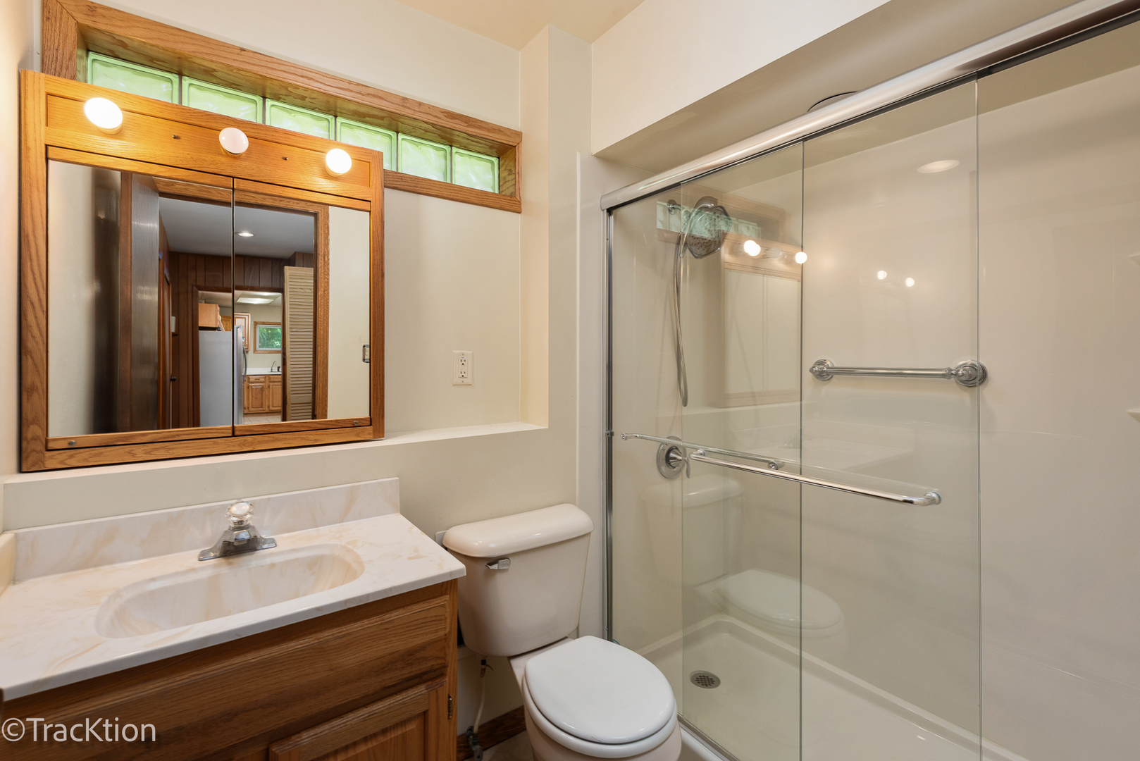 12S440 Lemont Road Lemont, IL 60439 - Photo 13 of 28 a bathroom with a sink a toilet and shower
