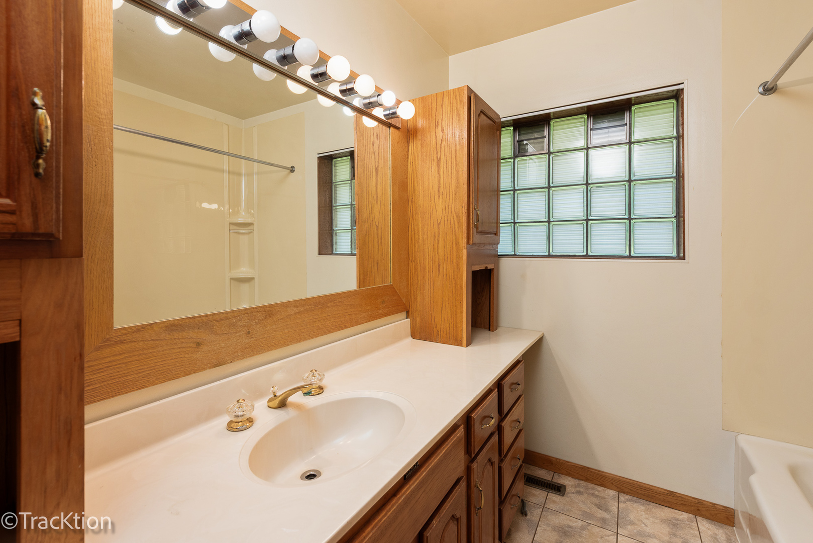 12S440 Lemont Road Lemont, IL 60439 - Photo 15 of 28 a bathroom with a sink and a mirror