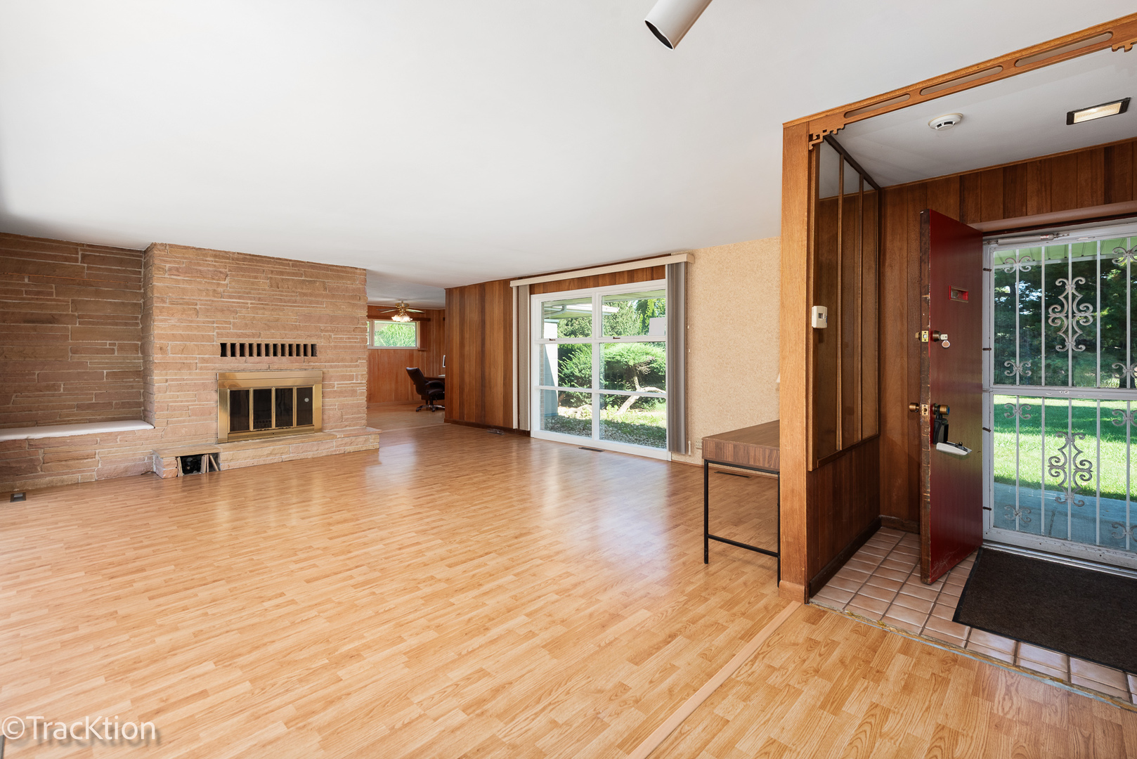 12S440 Lemont Road Lemont, IL 60439 - Photo 2 of 28 a view of a livingroom with furniture a fireplace and wooden floor