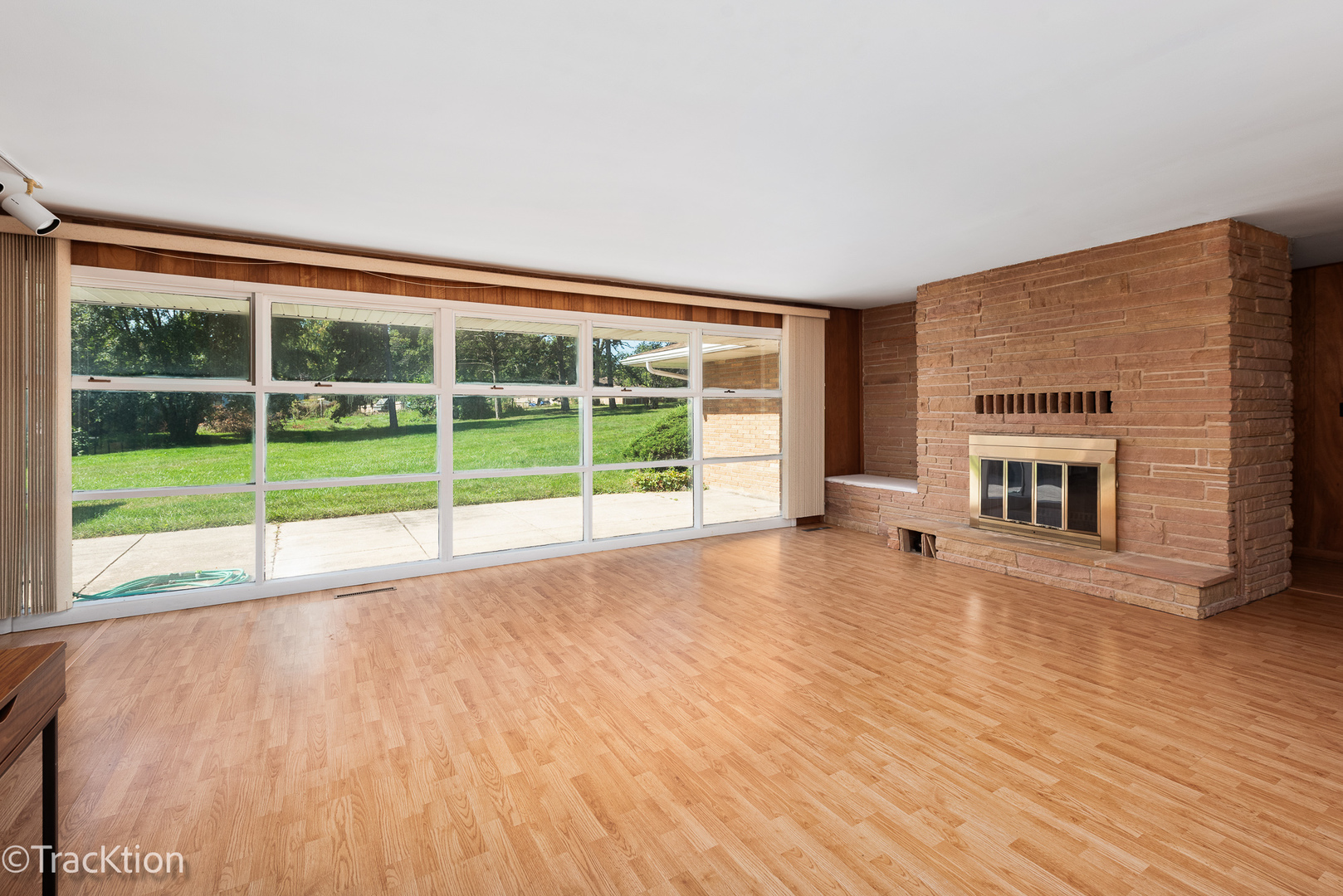 12S440 Lemont Road Lemont, IL 60439 - Photo 3 of 28 a view of an empty room with a window and wooden floor