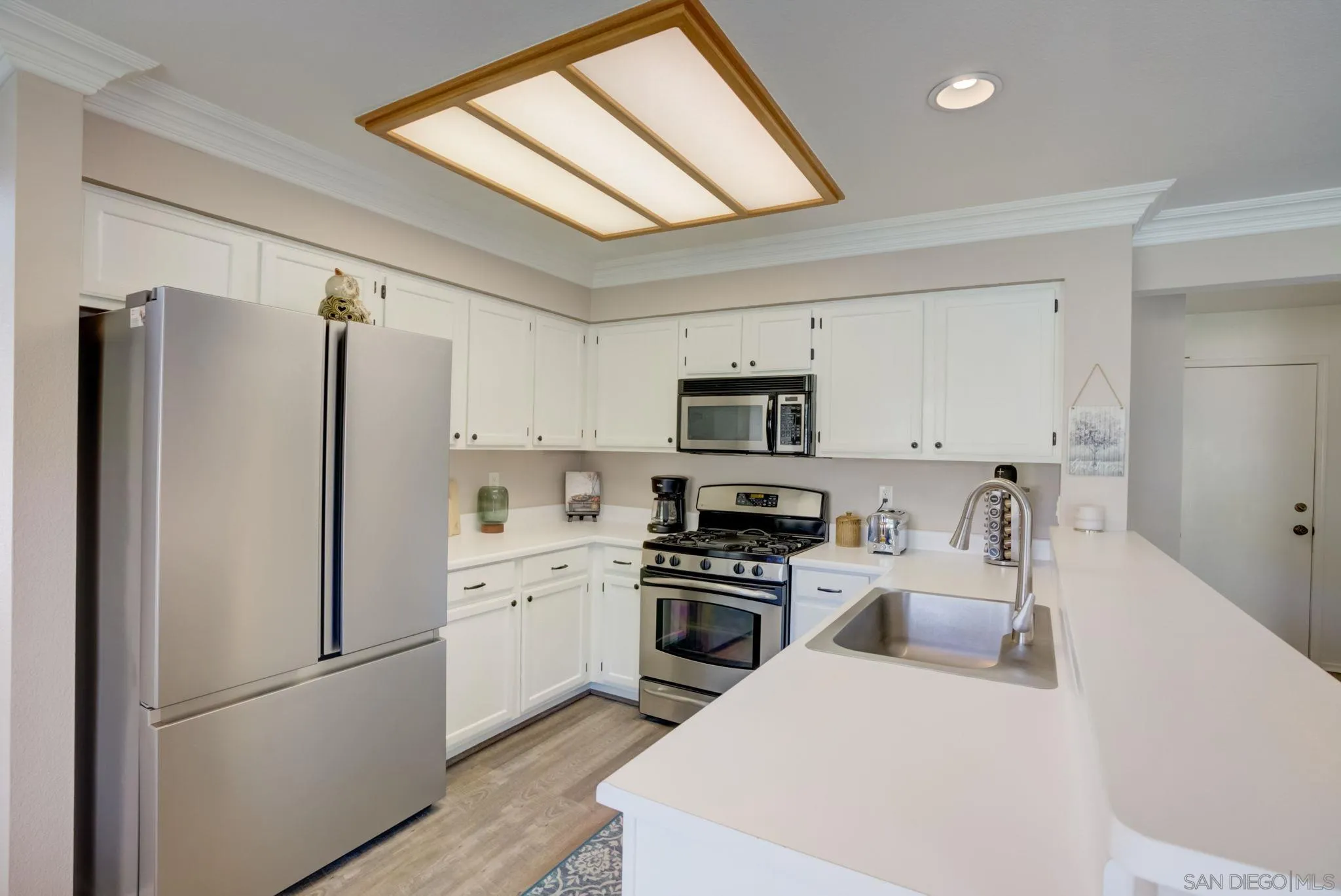 32012 Calle Espinosa Temecula, CA 92592 - Photo 11 of 53 a kitchen with stainless steel appliances a refrigerator sink and stove