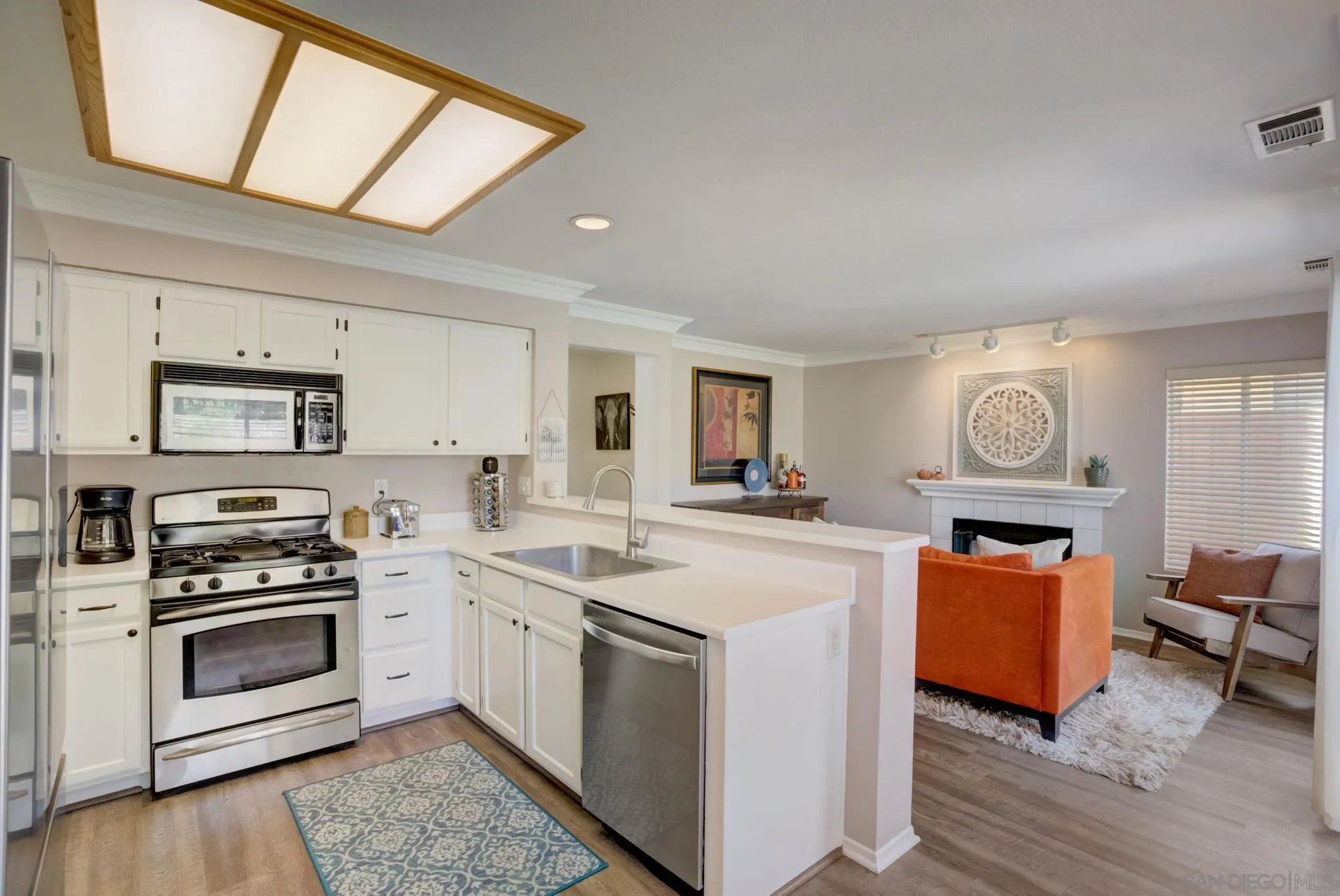 32012 Calle Espinosa Temecula, CA 92592 - Photo 12 of 53 a kitchen with stainless steel appliances granite countertop a stove and a refrigerator