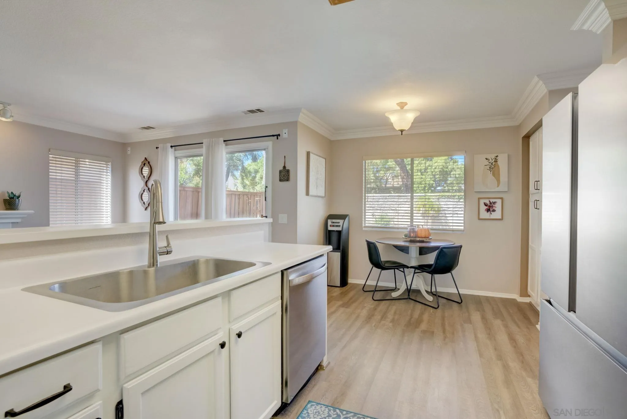 32012 Calle Espinosa Temecula, CA 92592 - Photo 14 of 53 a kitchen with a sink and wooden floors