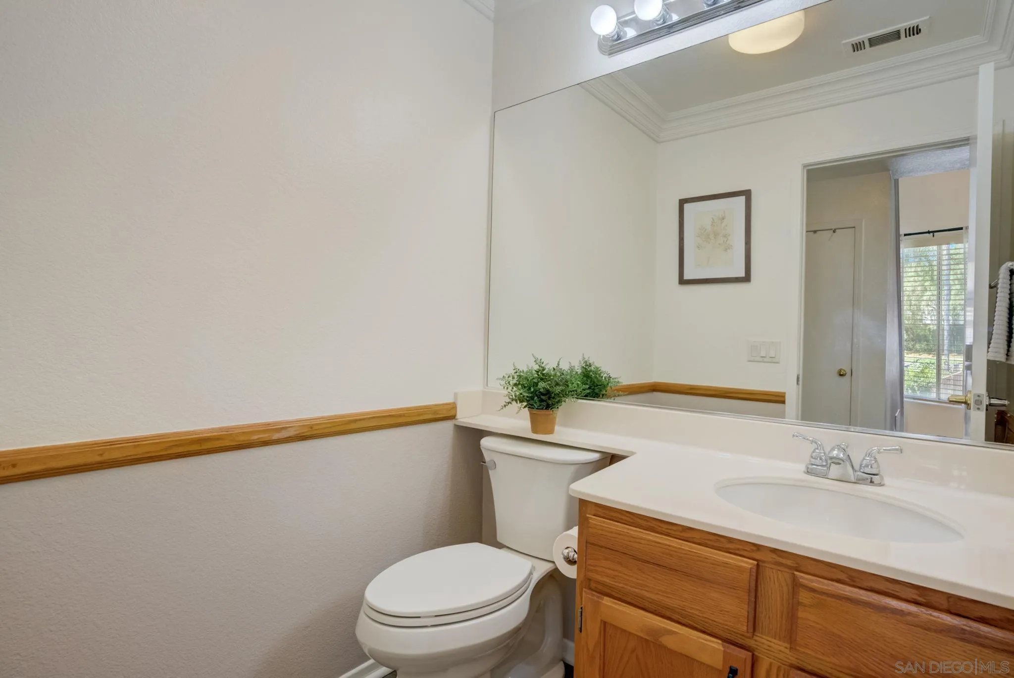 32012 Calle Espinosa Temecula, CA 92592 - Photo 19 of 53 a bathroom with a granite countertop sink a mirror and a toilet