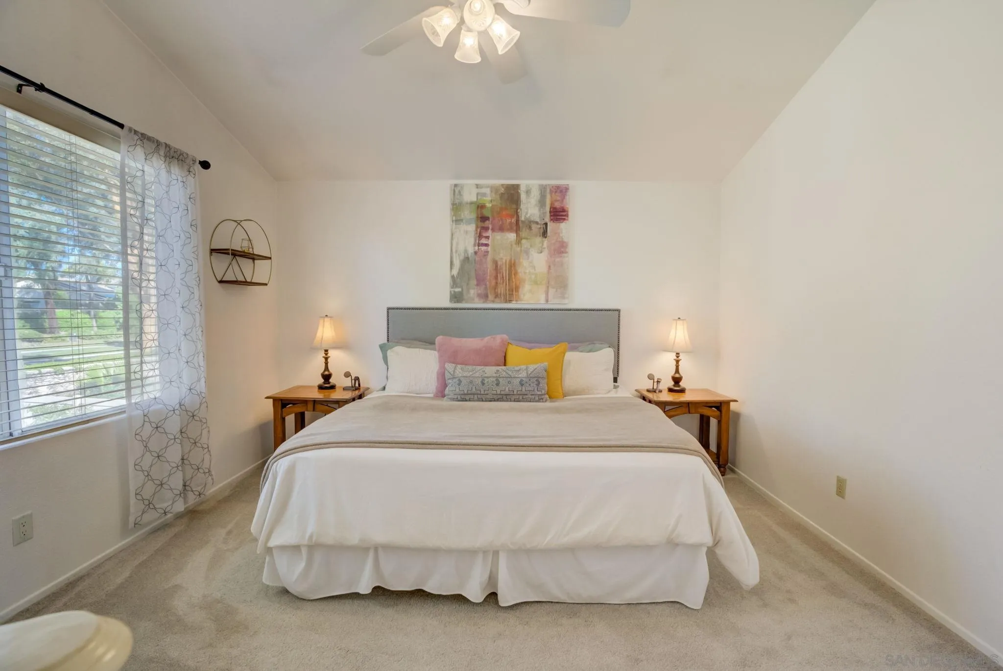 32012 Calle Espinosa Temecula, CA 92592 - Photo 21 of 53 a bedroom with a bed and a chandelier