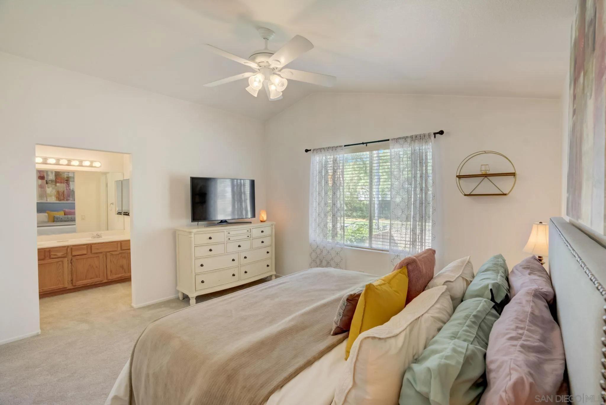 32012 Calle Espinosa Temecula, CA 92592 - Photo 22 of 53 a bedroom with a bed and a chandelier