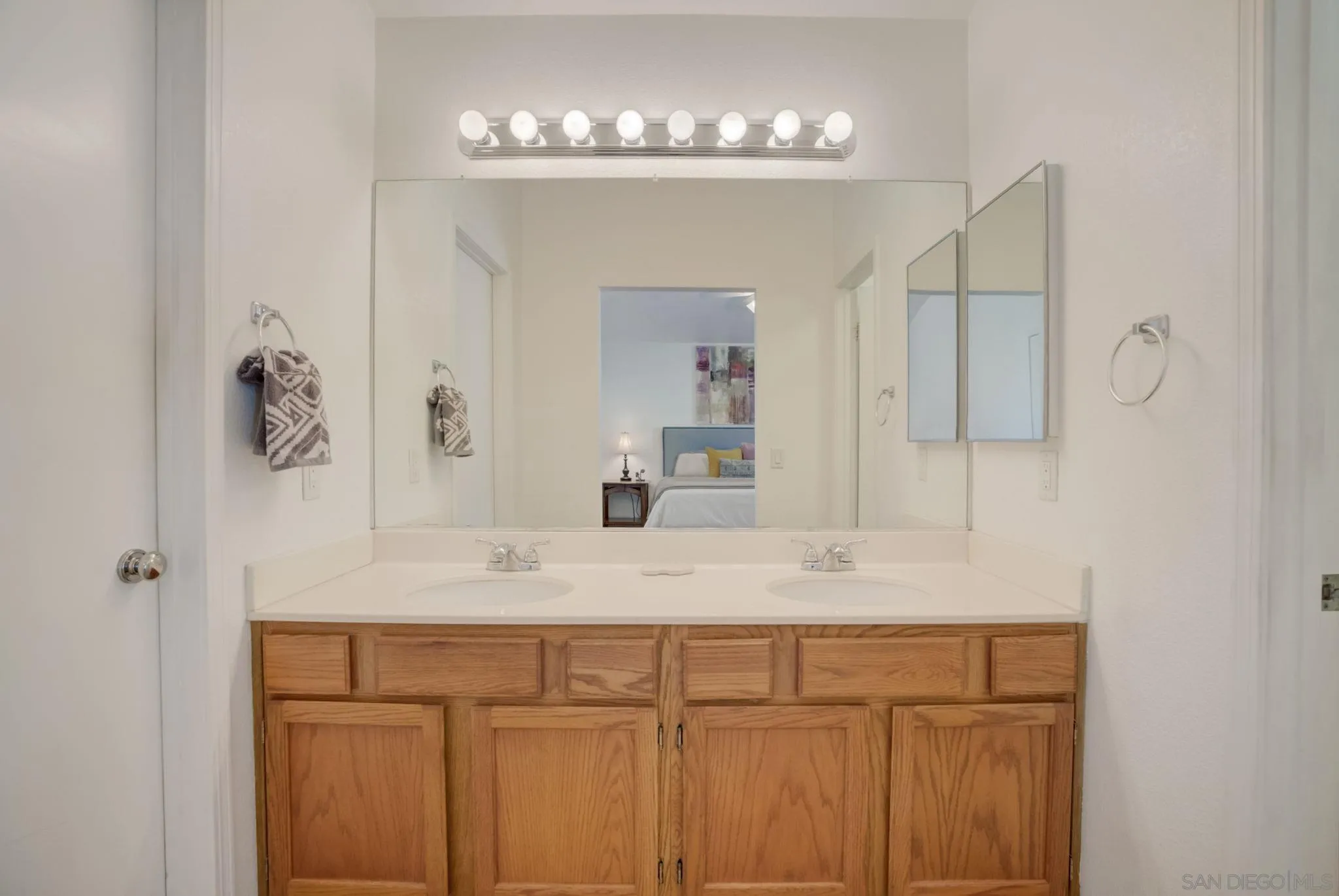 32012 Calle Espinosa Temecula, CA 92592 - Photo 23 of 53 a bathroom with a sink vanity and a mirror