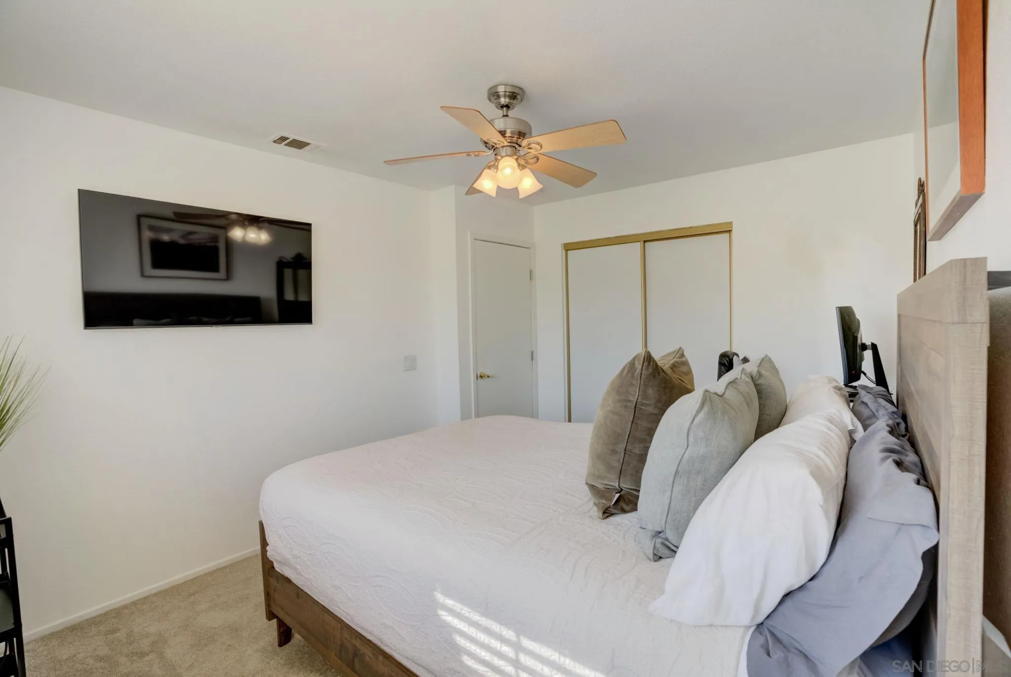 32012 Calle Espinosa Temecula, CA 92592 - Photo 30 of 53 a bedroom with a bed and a flat screen tv