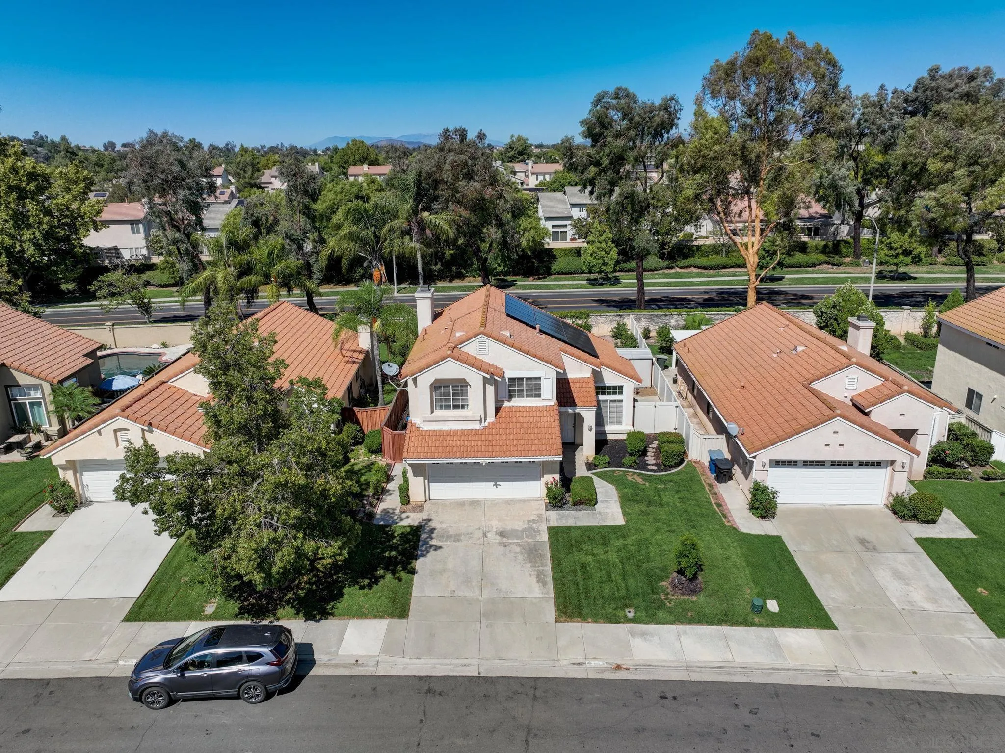 32012 Calle Espinosa Temecula, CA 92592 - Photo 44 of 53 an aerial view of a house with a yard and a car park side of a road