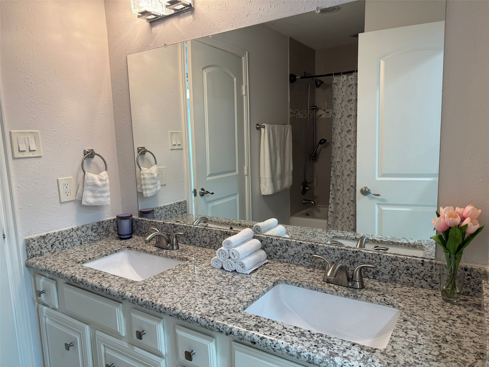 9626 Magnolia Ridge Drive Houston, TX 77070 - Photo 20 of 40 a bathroom with a granite countertop sink and a mirror