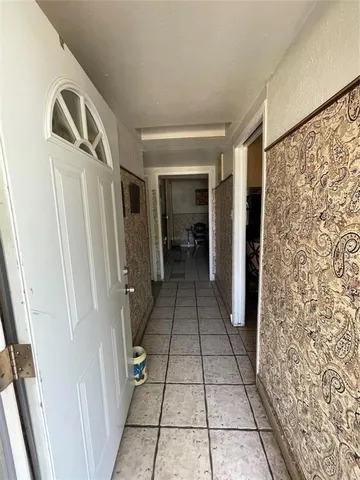 a view of walk in closet with wooden floor