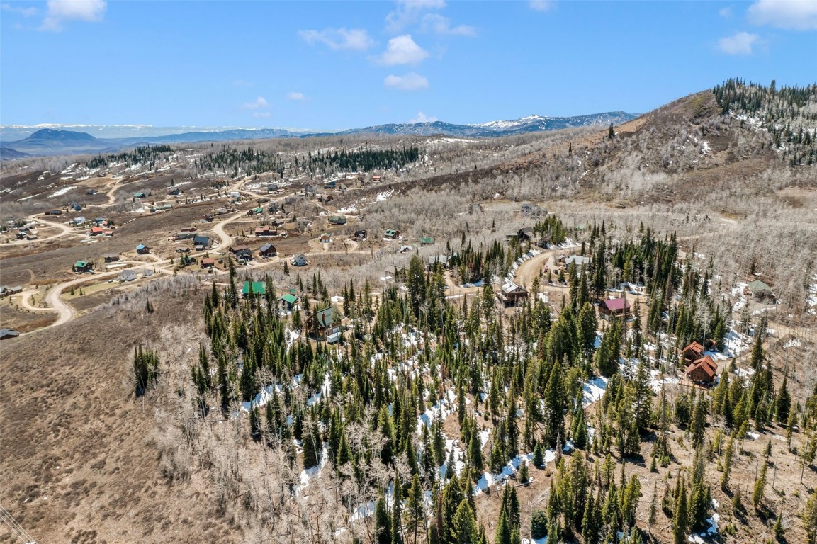 57930 Jupiter Place Clark, CO 80428 - Photo 9 of 10 a view of a large building with mountains in the background