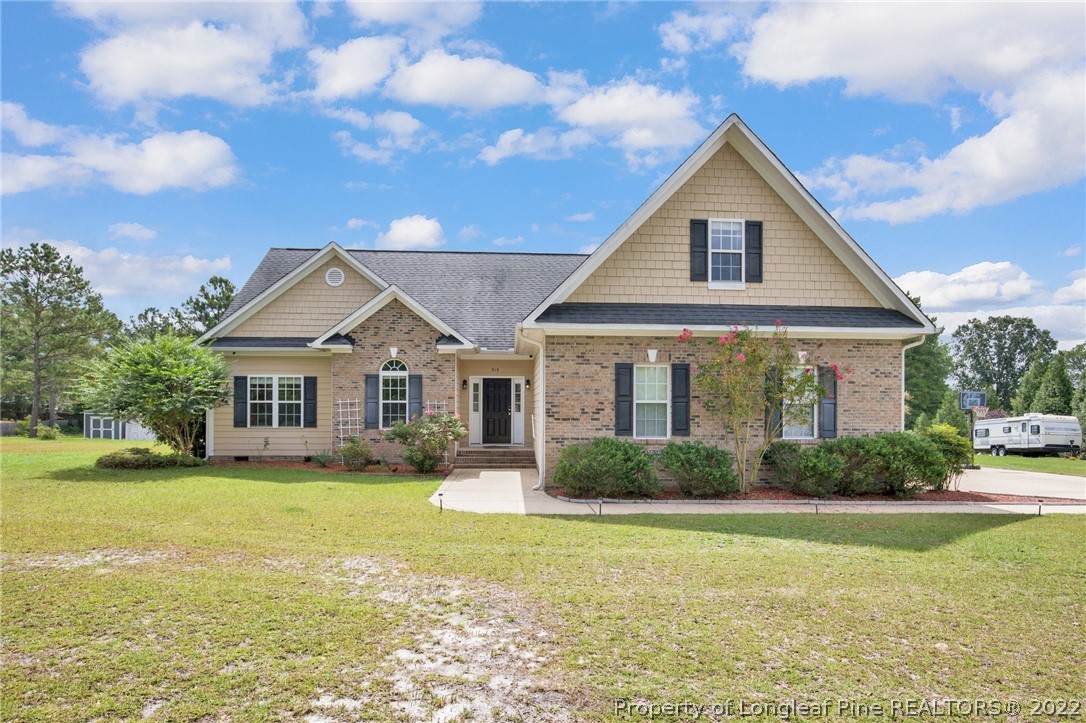 515 Booth Pond Road Raeford, NC 28376 - Photo 1 of 39 a view of a house with a yard