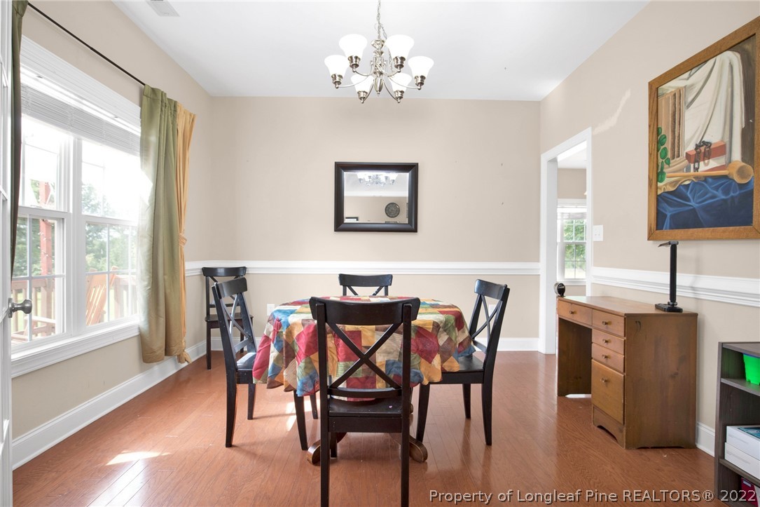 515 Booth Pond Road Raeford, NC 28376 - Photo 11 of 39 a view of a dining room with furniture window and wooden floor