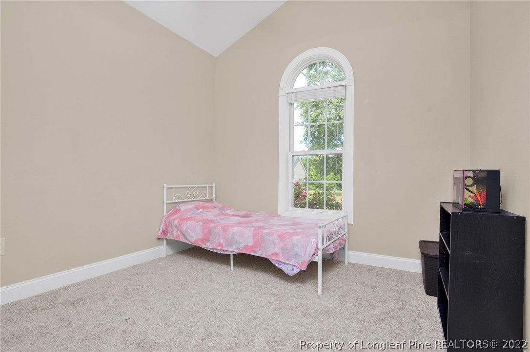 515 Booth Pond Road Raeford, NC 28376 - Photo 19 of 39 a bedroom with a bed and window