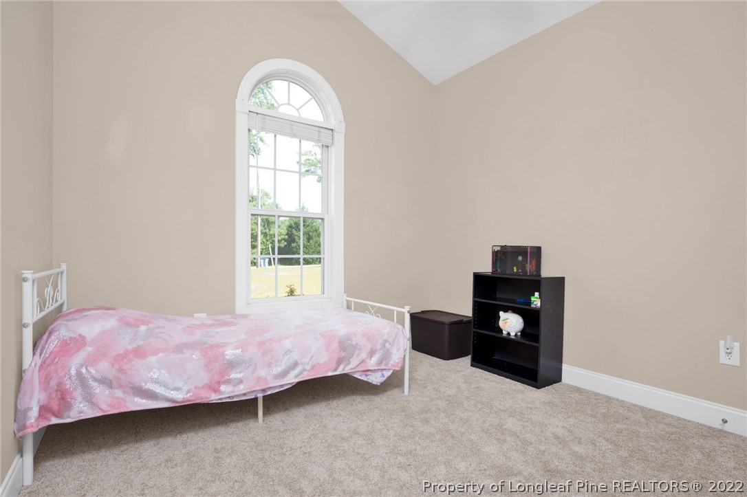 515 Booth Pond Road Raeford, NC 28376 - Photo 20 of 39 a bedroom with a bed and a window