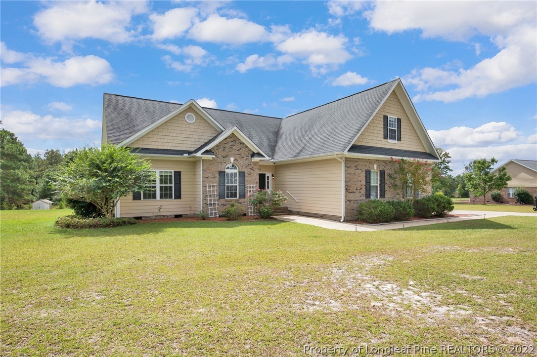 515 Booth Pond Road Raeford, NC 28376 - Photo 2 of 39 a front view of a house with a yard