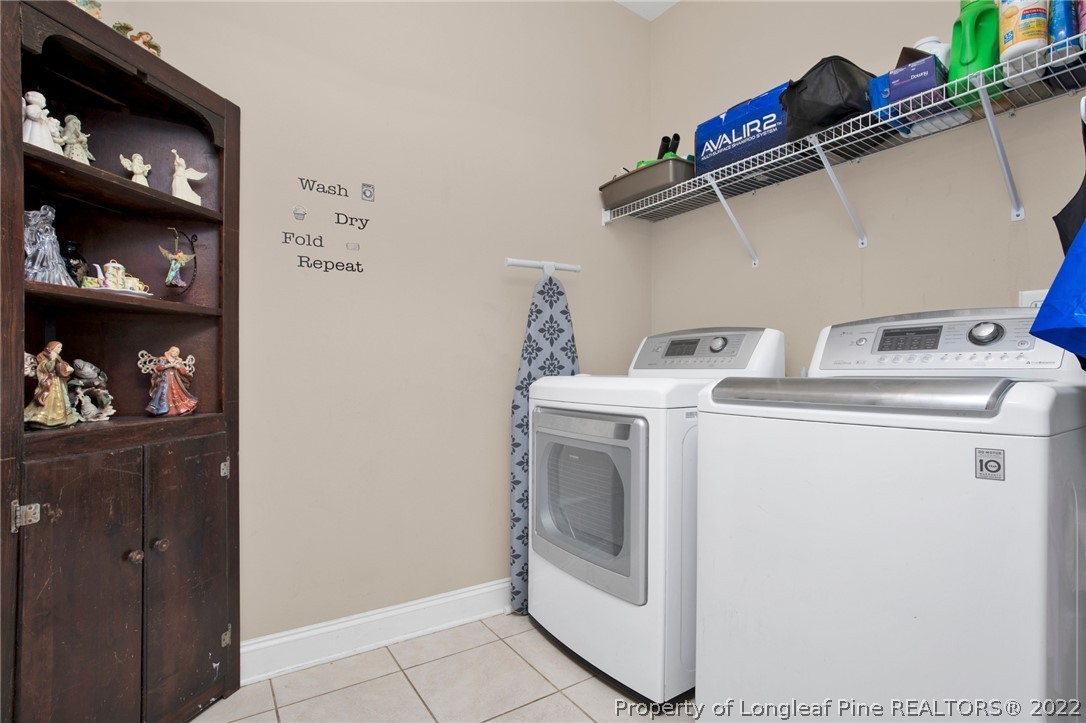 515 Booth Pond Road Raeford, NC 28376 - Photo 23 of 39 a utility room with dryer and washer