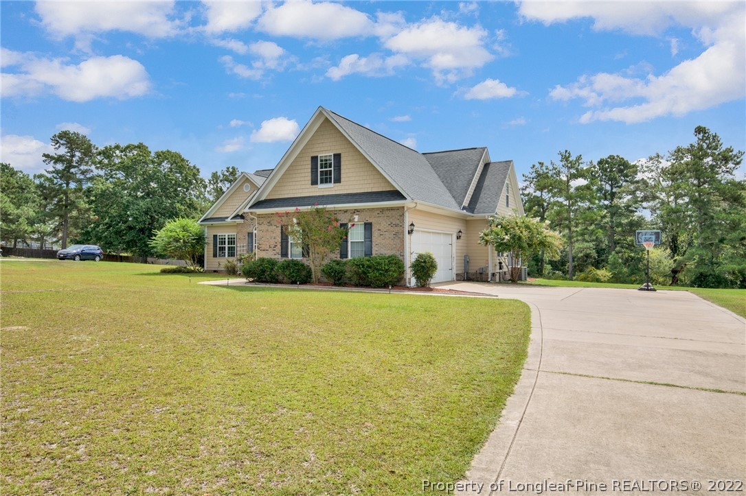 515 Booth Pond Road Raeford, NC 28376 - Photo 3 of 39 a front view of a house with a yard