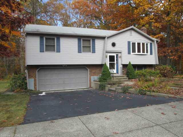 a front view of a house with garage