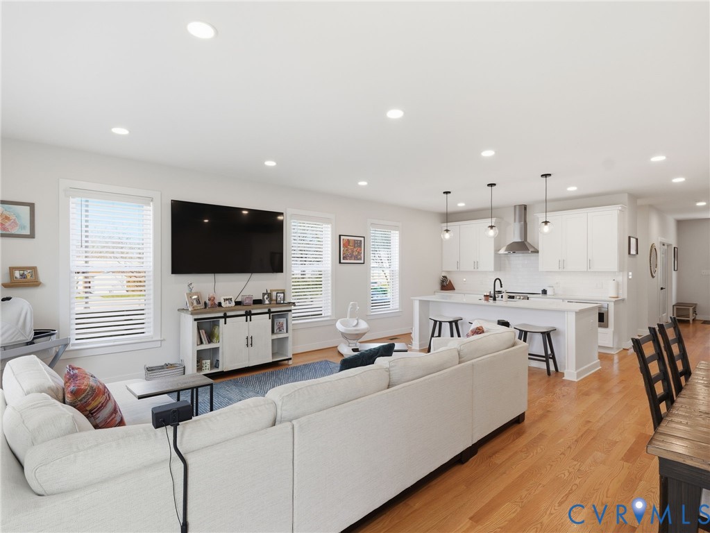 1202 North 34th Street Richmond, VA 23223 - Photo 12 of 36 Living area featuring light wood finished floors a