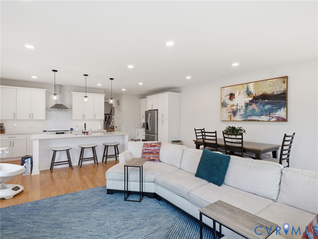 1202 North 34th Street Richmond, VA 23223 - Photo 13 of 36 Living area with light wood finished floors and re