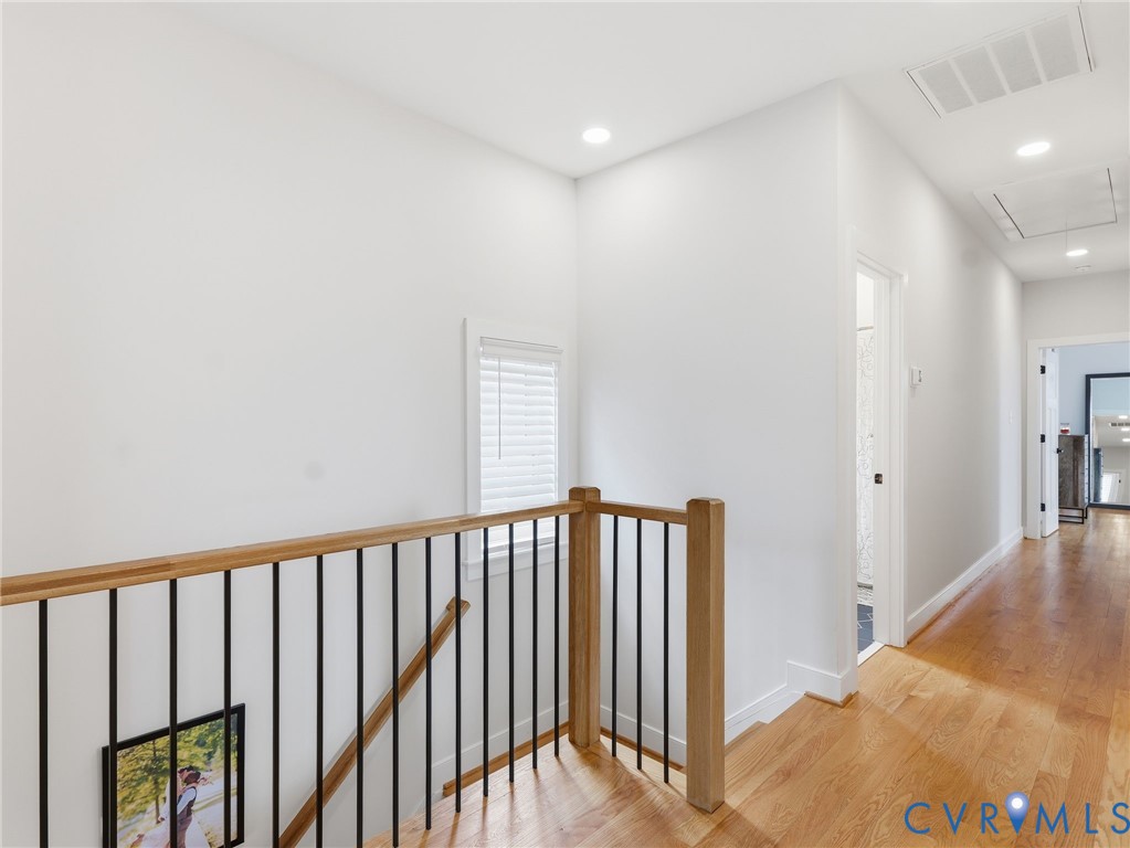 1202 North 34th Street Richmond, VA 23223 - Photo 20 of 36 Hall with light wood-style flooring, an upstairs l