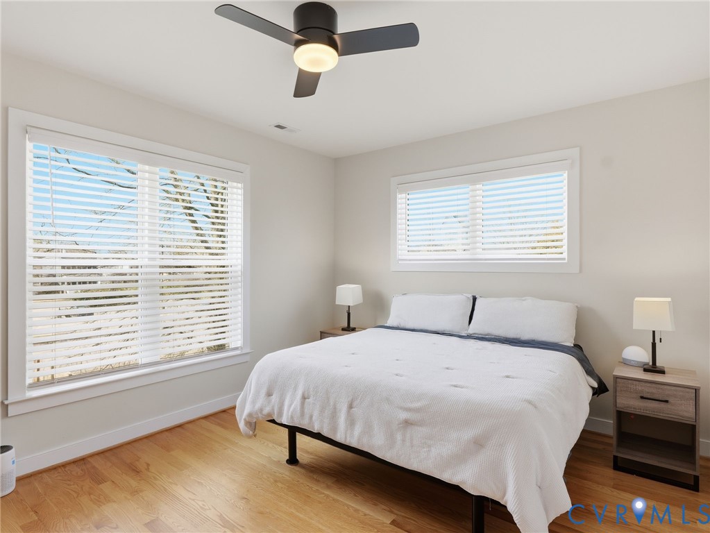 1202 North 34th Street Richmond, VA 23223 - Photo 21 of 36 Bedroom with light wood-style floors and a ceiling