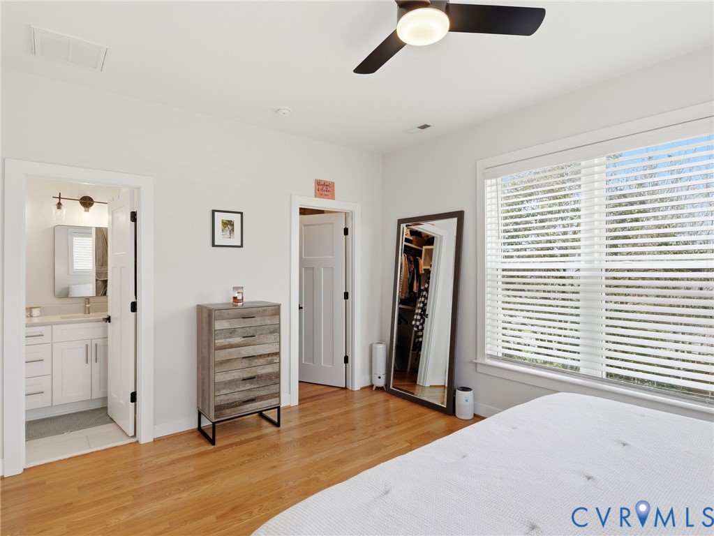 1202 North 34th Street Richmond, VA 23223 - Photo 22 of 36 Bedroom featuring light wood finished floors, a wa