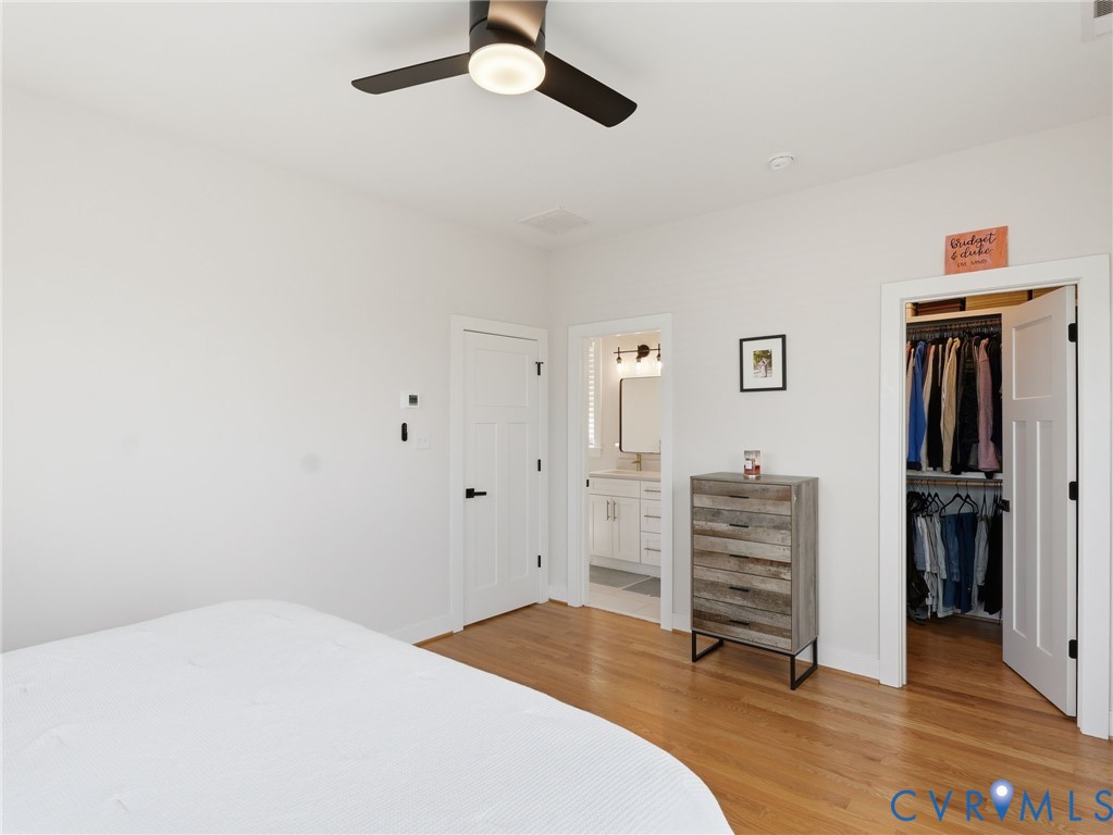 1202 North 34th Street Richmond, VA 23223 - Photo 23 of 36 Bedroom with light wood-type flooring, a spacious