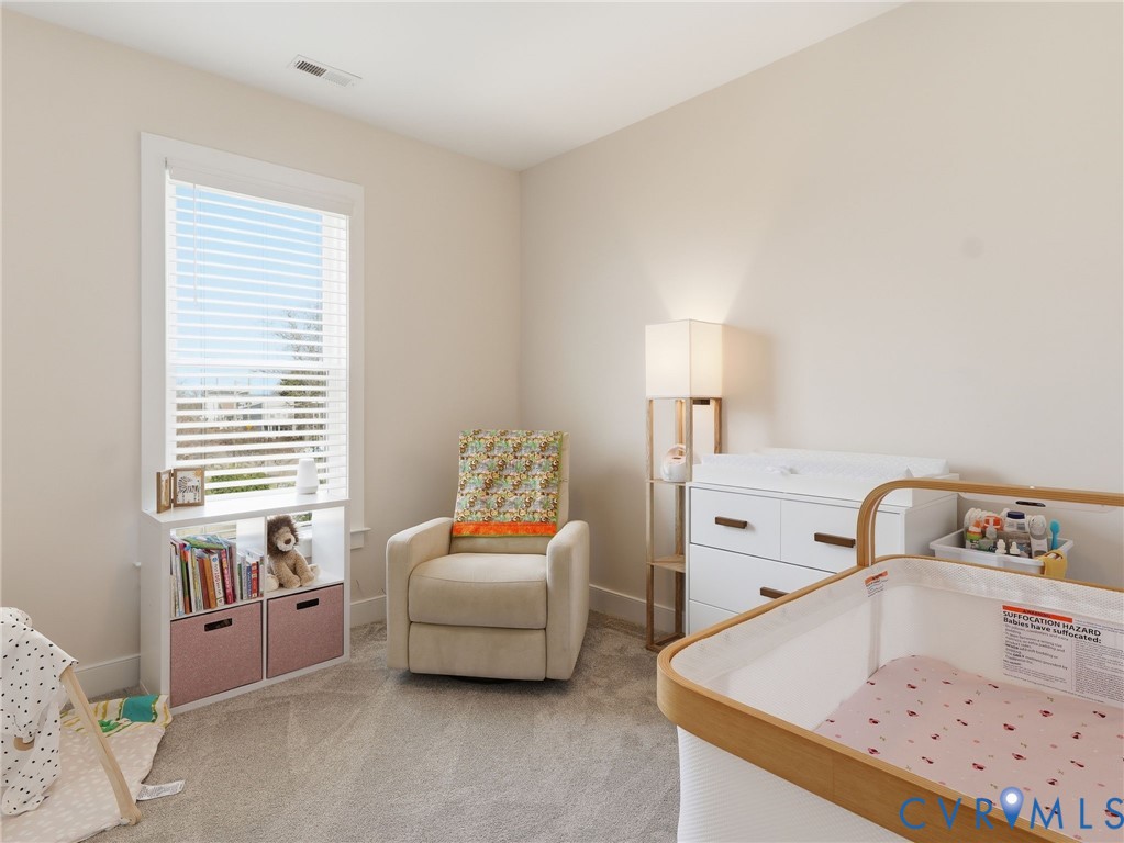 1202 North 34th Street Richmond, VA 23223 - Photo 24 of 36 Bedroom featuring light colored carpet and baseboa