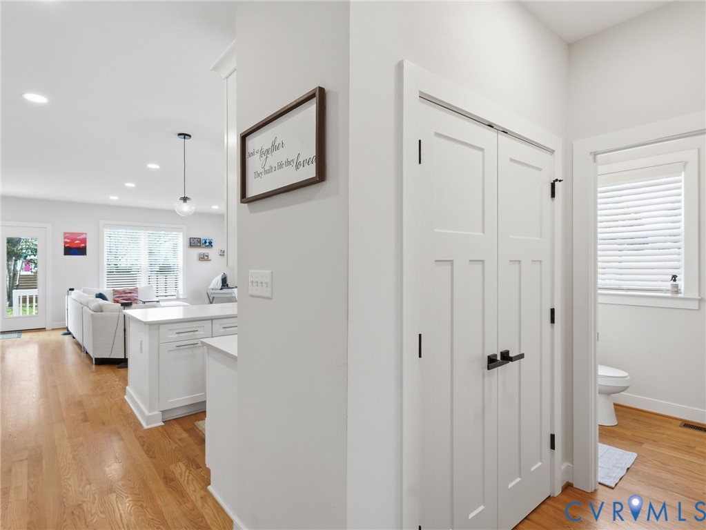 1202 North 34th Street Richmond, VA 23223 - Photo 3 of 36 Hallway featuring light wood finished floors and r