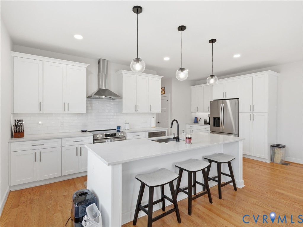 1202 North 34th Street Richmond, VA 23223 - Photo 6 of 36 Kitchen with a breakfast bar, stainless steel appl