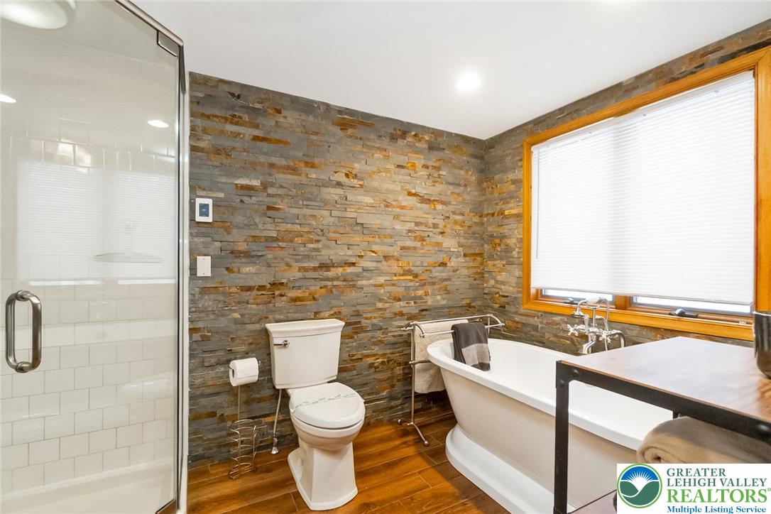 143 Moseywood Road Lake Harmony, PA 18624 - Photo 20 of 48 a bathroom with a toilet sink and shower