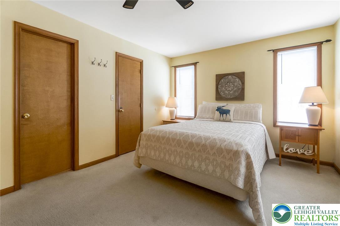 143 Moseywood Road Lake Harmony, PA 18624 - Photo 25 of 48 a bedroom with a bed and a painting on the wall