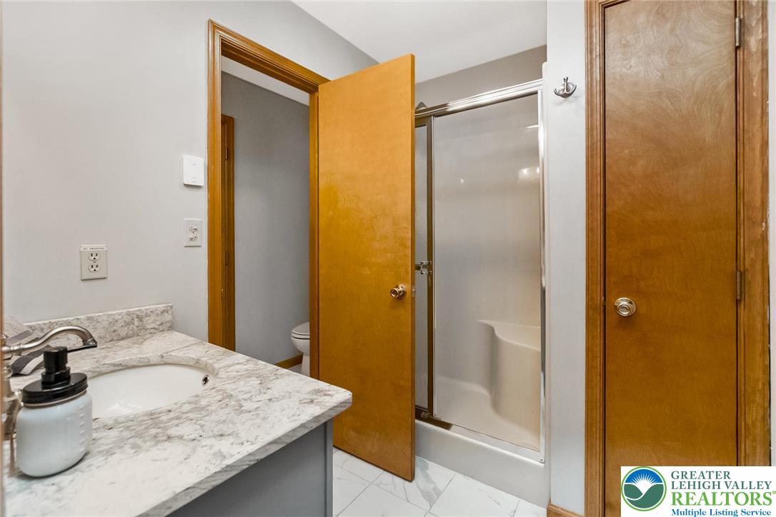 143 Moseywood Road Lake Harmony, PA 18624 - Photo 26 of 48 a bathroom with a sink and a mirror