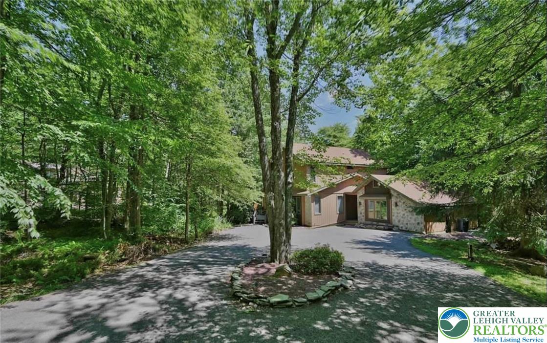 143 Moseywood Road Lake Harmony, PA 18624 - Photo 3 of 48 a house view with a outdoor space