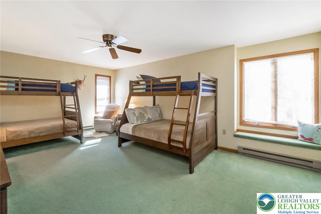 143 Moseywood Road Lake Harmony, PA 18624 - Photo 35 of 48 a bedroom with a bed chair and window
