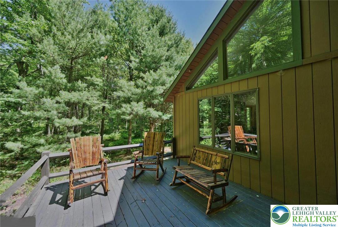 143 Moseywood Road Lake Harmony, PA 18624 - Photo 4 of 48 a view of a two chairs in the balcony