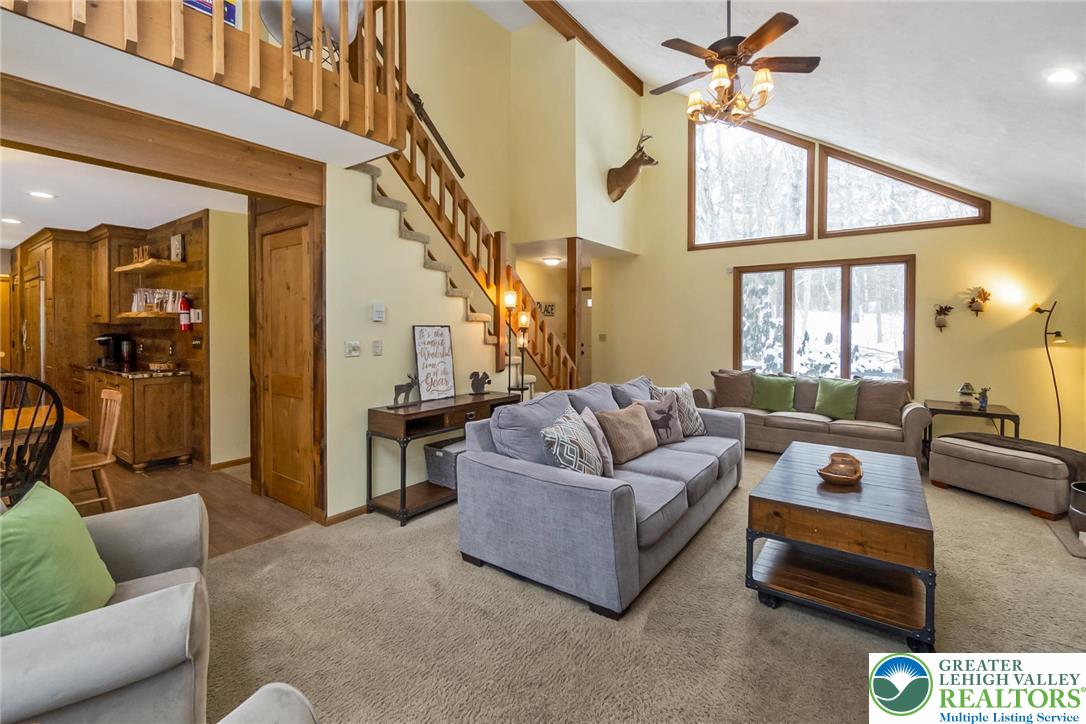 143 Moseywood Road Lake Harmony, PA 18624 - Photo 7 of 48 a living room with furniture and a large window