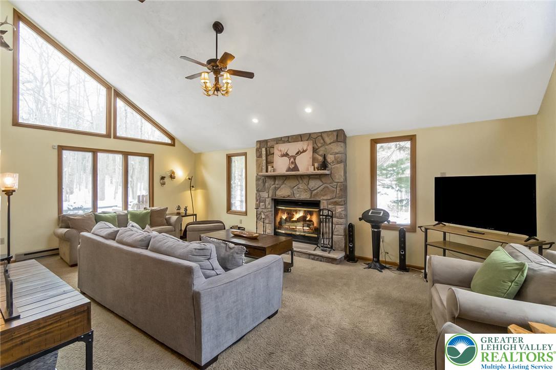 143 Moseywood Road Lake Harmony, PA 18624 - Photo 8 of 48 a living room with furniture and a flat screen tv