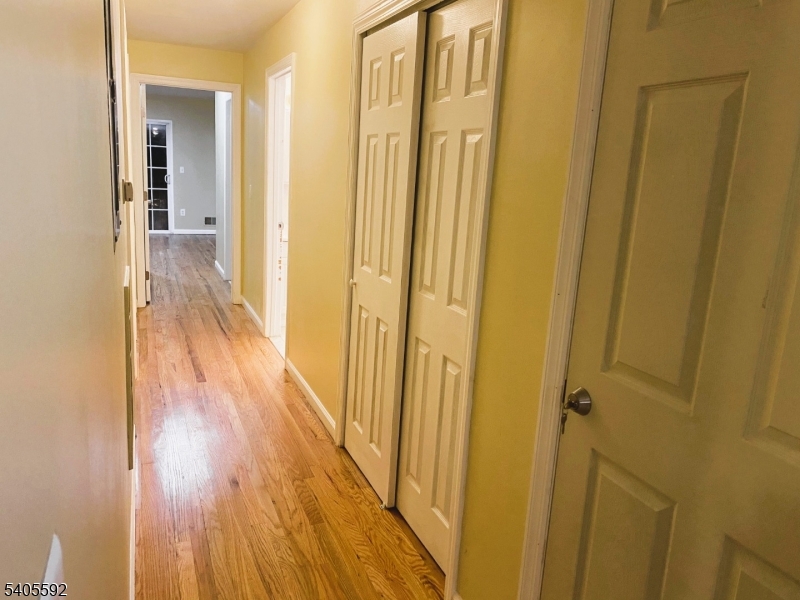 94 Palm Street, Unit 1 Newark, NJ 07106 - Photo 11 of 24 a view of a hallway with wooden floor